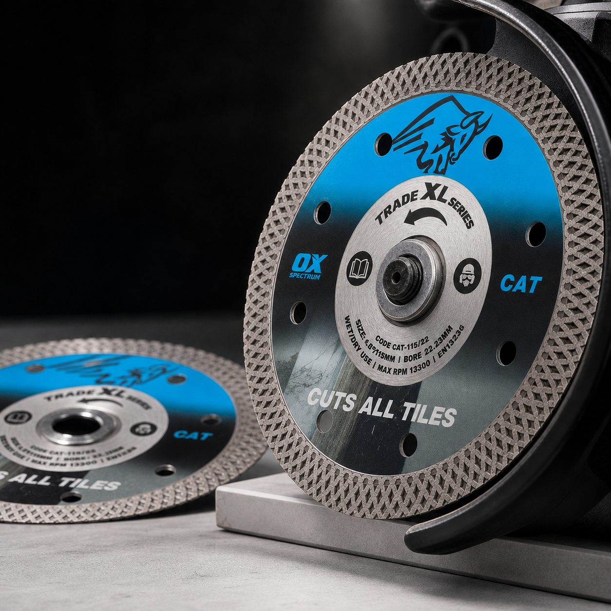OX Spectrum Trade XL CAT 115mm diamond blade mounted on an angle grinder, designed for wet or dry cutting of porcelain, ceramic and other tiles.