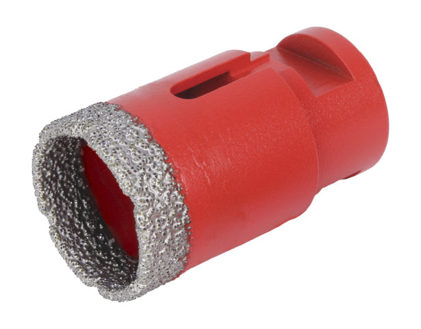 Dry diamond core drill bit on angle grinder for fast drilling through porcelain tiles