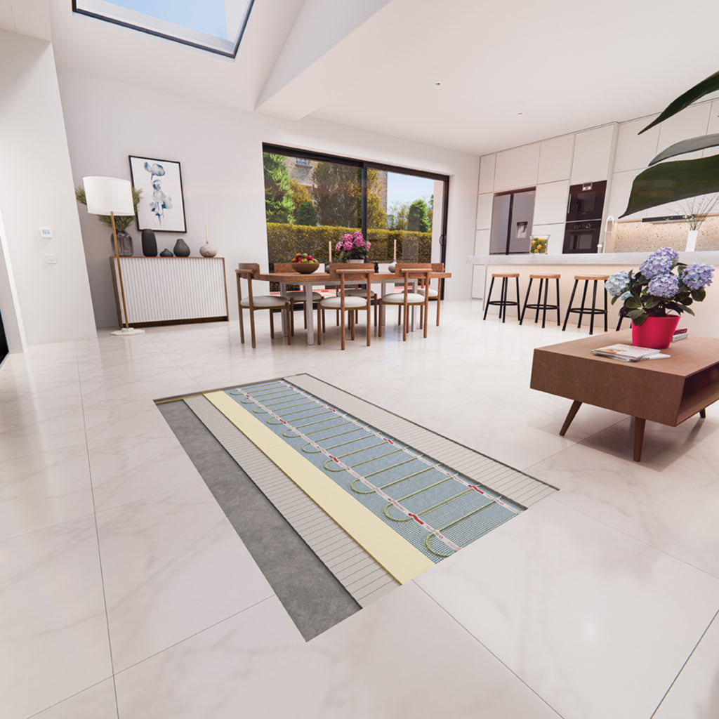 A radiant floor heating system shown installed in a large light-colored tiled living room and kitchen. The heating mat features a gray outer border, a pale yellow center, and multiple rows of red and blue heating elements.