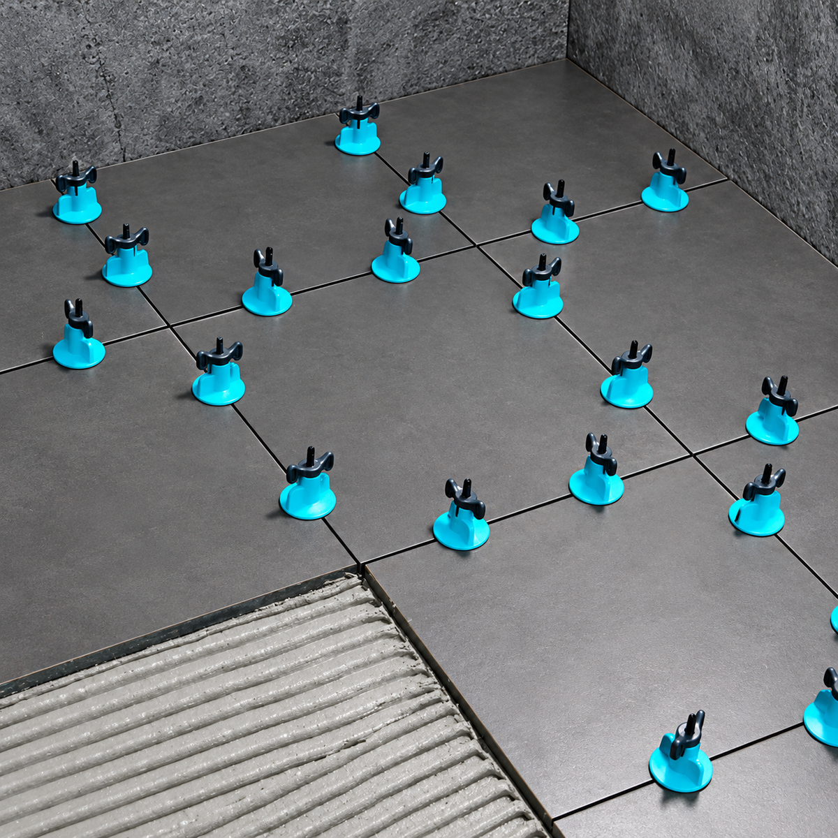 Bihui T-Spin tile levelling system in use levelling porcelain floor tiles