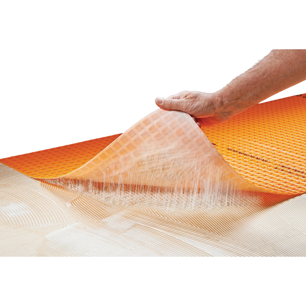 Step 3 of the Ardex AF200 Plus matting-installation process — laying the uncoupling matting onto the adhesive bed.