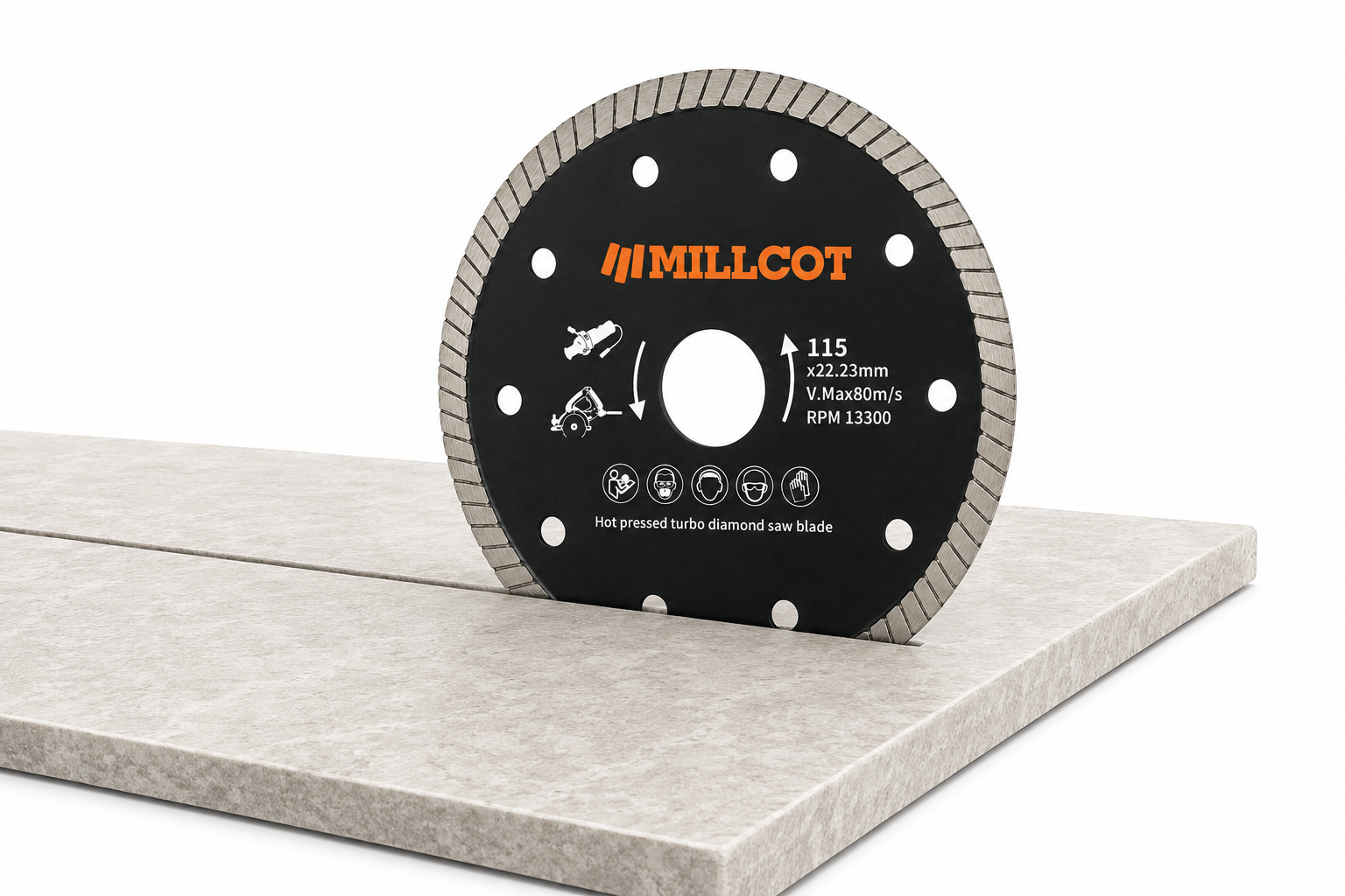 MILLCOT 115mm turbo diamond blade cutting through a porcelain tile, showing fast chip-free porcelain and ceramic tile cutting on an angle grinder