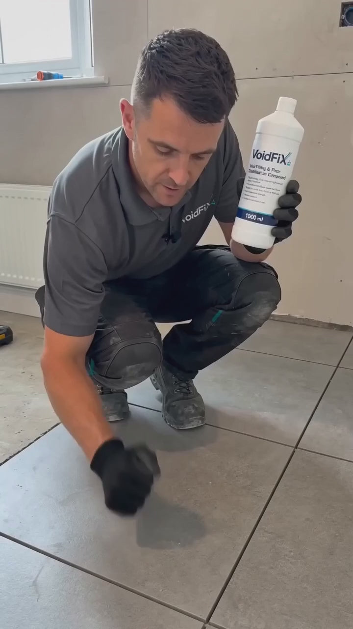 SUBSTRAT VoidFiX Pro being injected through a grout joint to fill hollow voids beneath ceramic and porcelain tiles without removing the tiles.